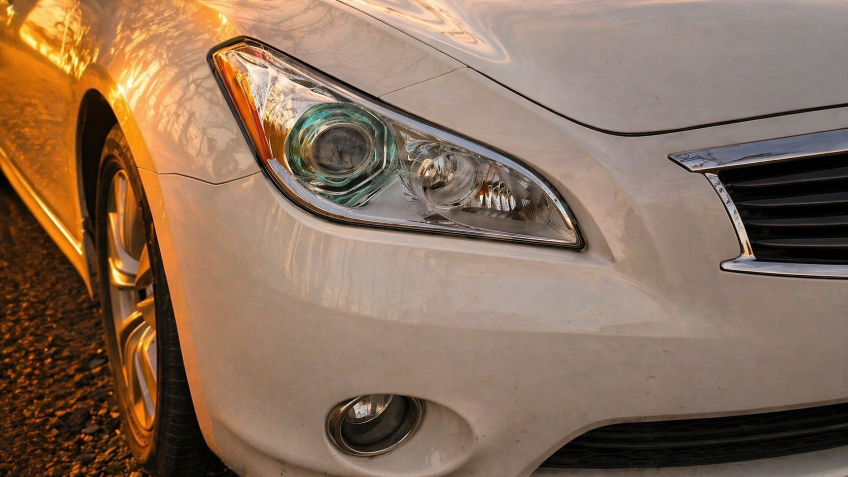 Professional multi-stage headlight restoration result — clear oxidation-free lens by OptiGlow, Greensboro NC, starting at $119